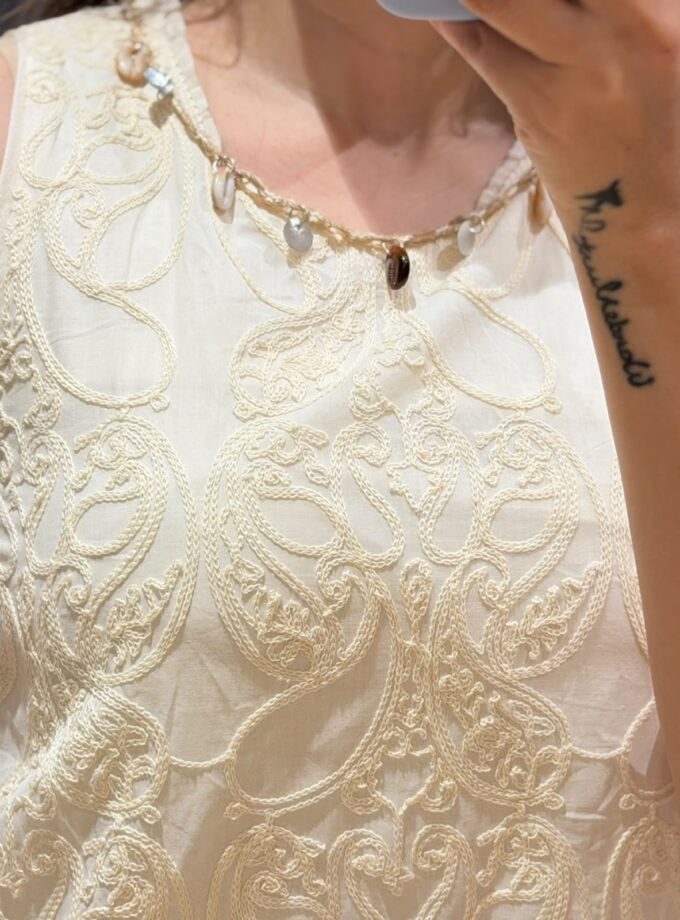 Embroidered dress with shell detailings