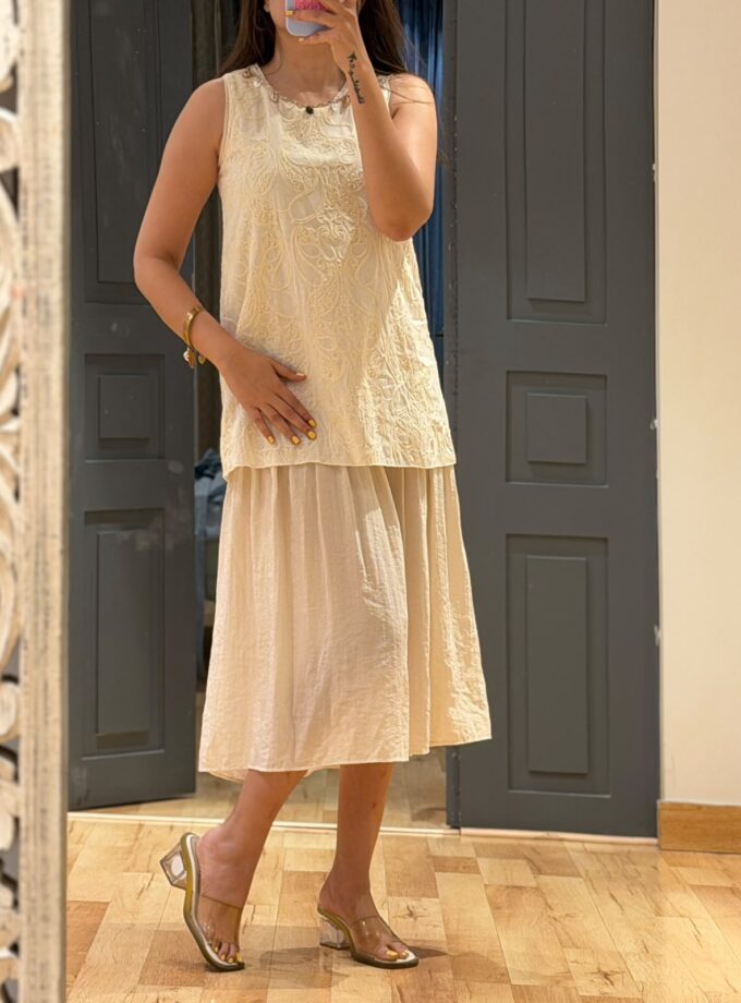 Embroidered dress with shell detailings