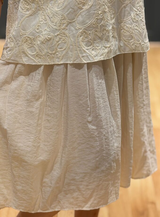 Embroidered dress with shell detailings